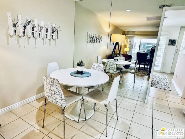 dining area featuring light tile patterned floors