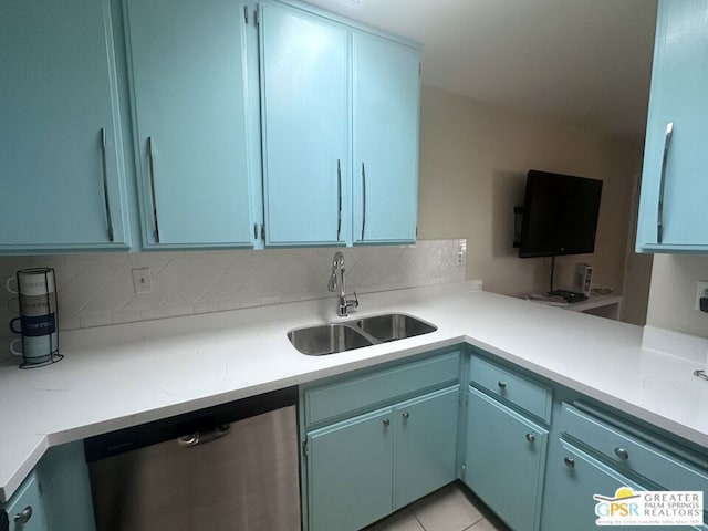 kitchen featuring light tile patterned flooring, dishwasher, sink, and tasteful backsplash