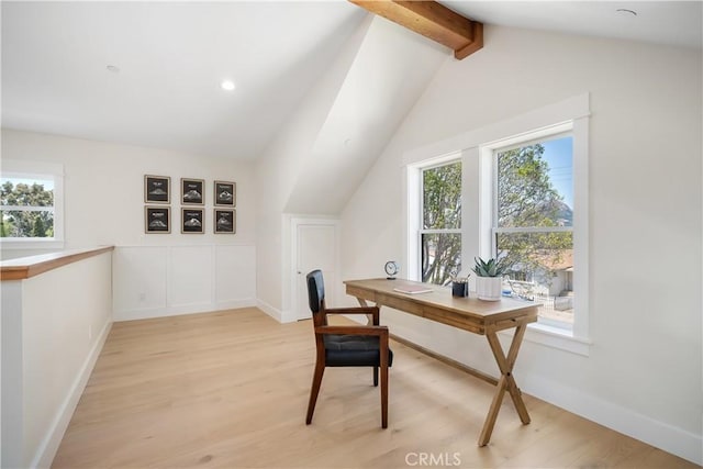 home office featuring lofted ceiling with beams and light hardwood / wood-style floors