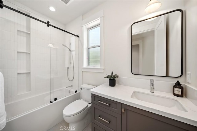 full bathroom featuring vanity, bathtub / shower combination, and toilet