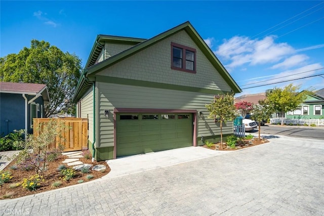 view of side of property featuring a garage