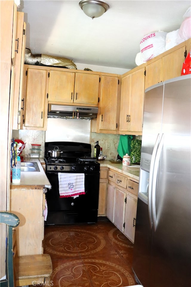 kitchen with sink, black gas range, stainless steel fridge with ice dispenser, and backsplash