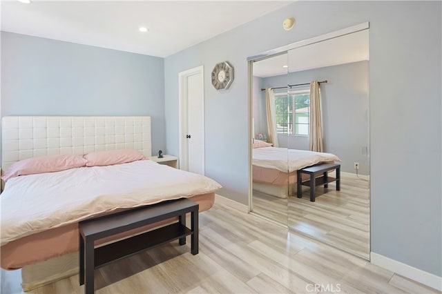 bedroom with light wood-type flooring