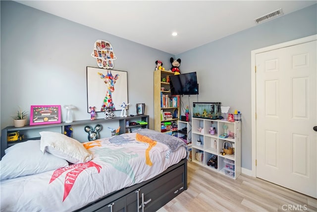 bedroom featuring light wood-type flooring