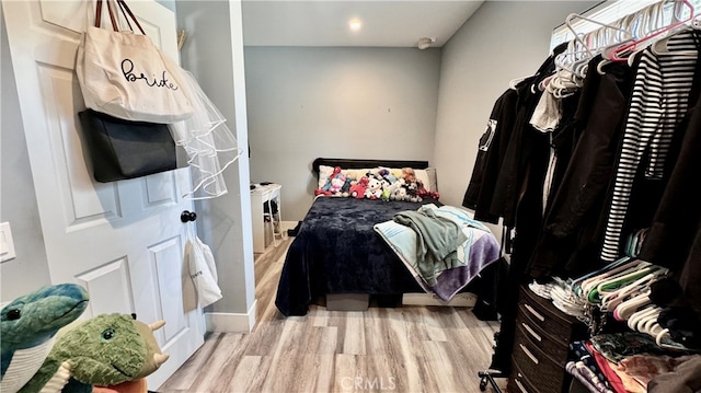 bedroom with light hardwood / wood-style flooring