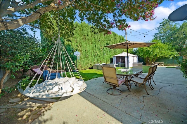 view of patio featuring a storage unit