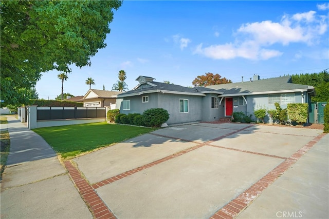 ranch-style home with a front lawn