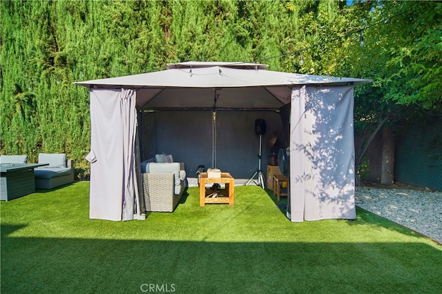 view of outdoor structure with an outdoor living space and a yard