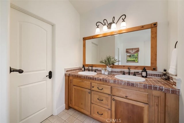 bathroom featuring tile patterned flooring and vanity