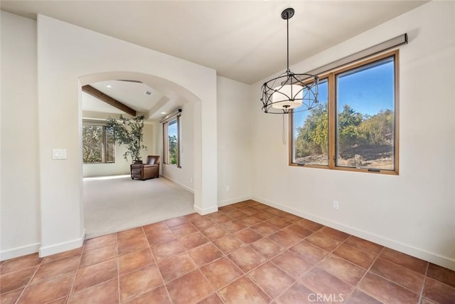 unfurnished dining area with tile patterned floors and a wealth of natural light