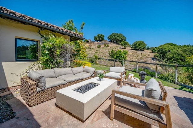 view of patio with a fire pit