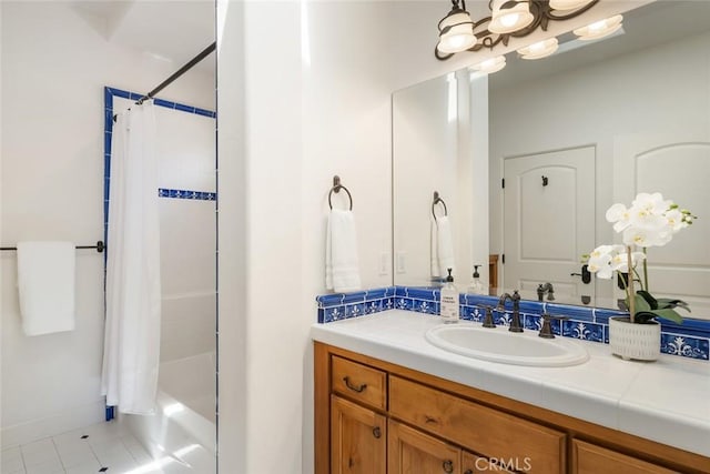 bathroom with tile patterned floors, shower / tub combo with curtain, and vanity