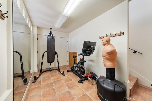 workout area with light tile patterned floors