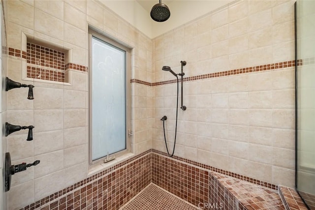 bathroom with tiled shower