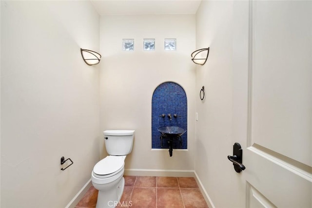 bathroom featuring tile patterned flooring and toilet