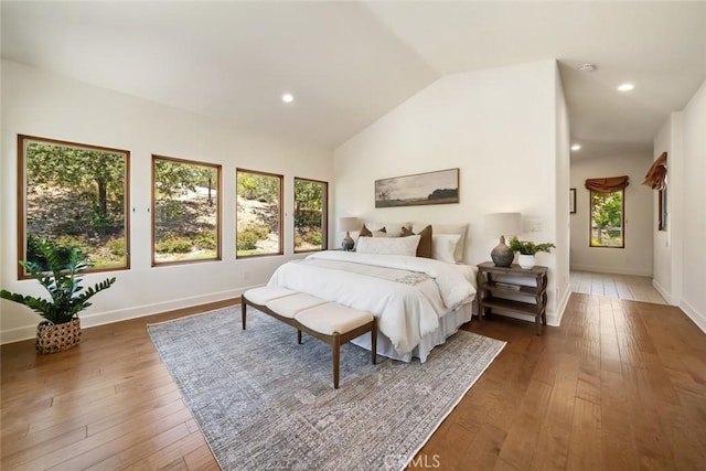 bedroom featuring vaulted ceiling and dark hardwood / wood-style floors