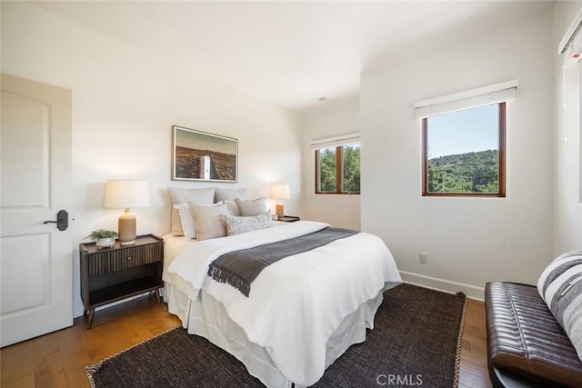 bedroom with hardwood / wood-style floors