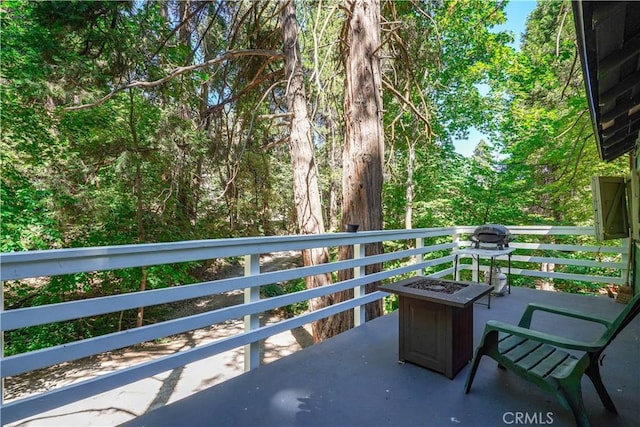 balcony featuring a fire pit