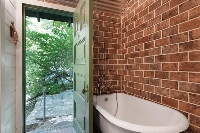 bathroom featuring a washtub