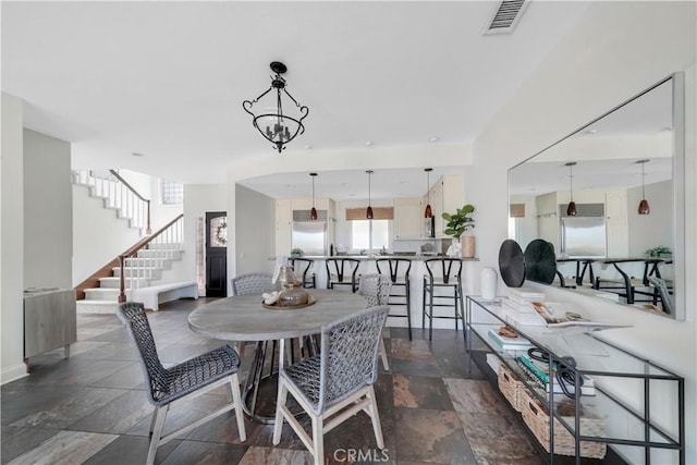 dining room featuring a notable chandelier