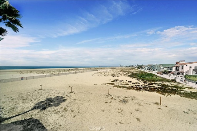 view of water feature with a beach view