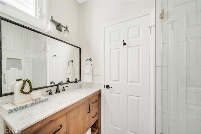 bathroom featuring vanity and walk in shower