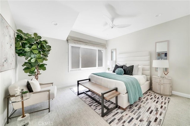 carpeted bedroom with ceiling fan