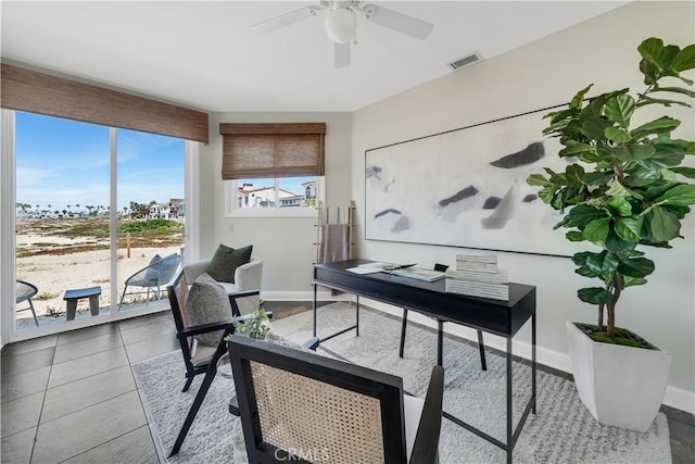 tiled home office with ceiling fan