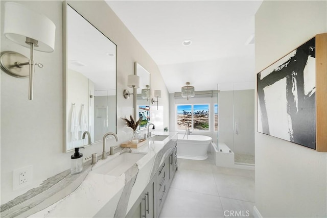 bathroom with tile patterned flooring, vanity, and plus walk in shower