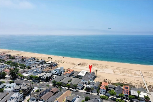 aerial view featuring a view of the beach and a water view