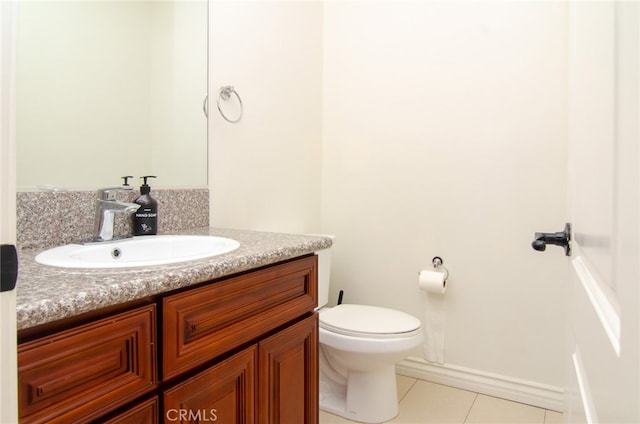 bathroom featuring vanity, toilet, and tile patterned floors