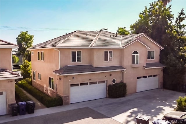 view of front of property featuring a garage