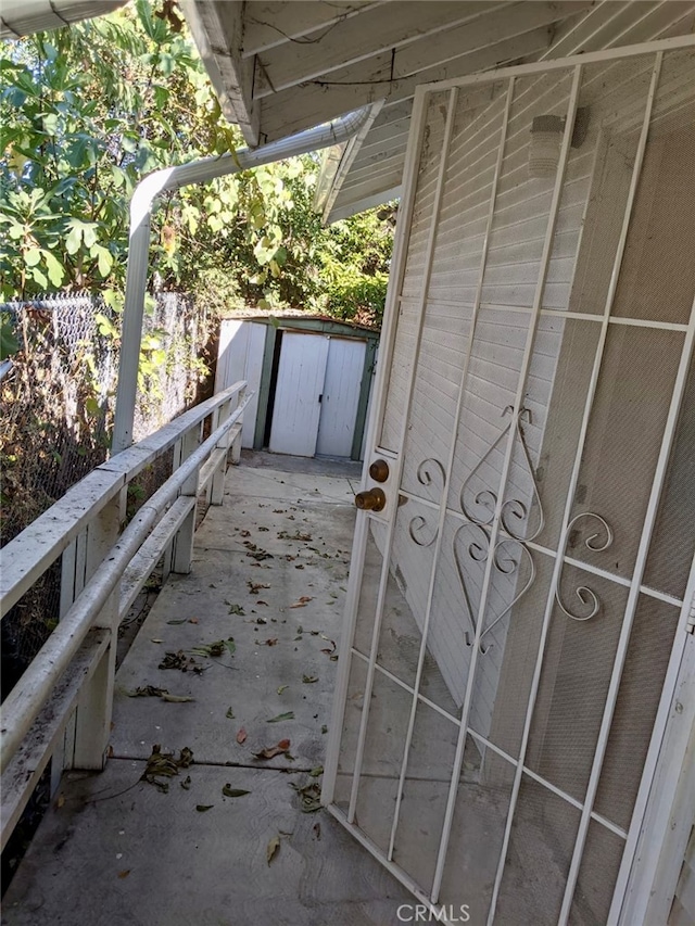 view of patio / terrace featuring a shed