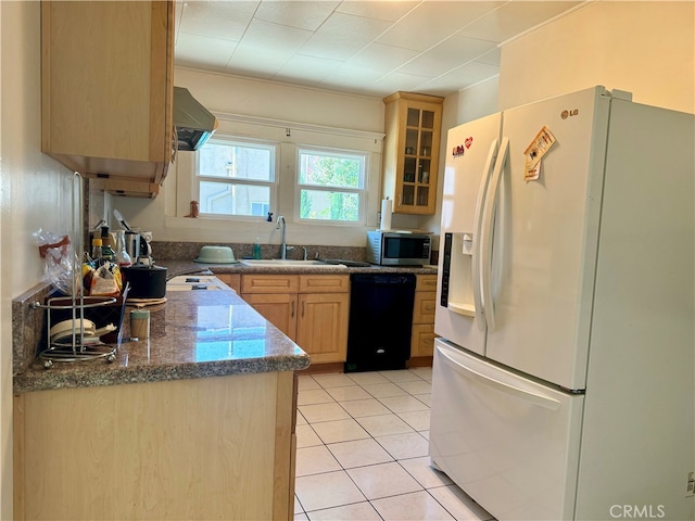 kitchen with light tile patterned flooring, ventilation hood, dishwasher, light brown cabinetry, and white refrigerator with ice dispenser