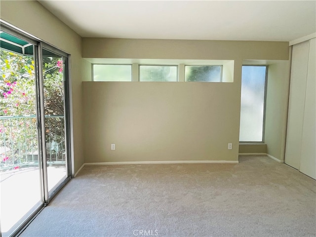 empty room featuring light carpet