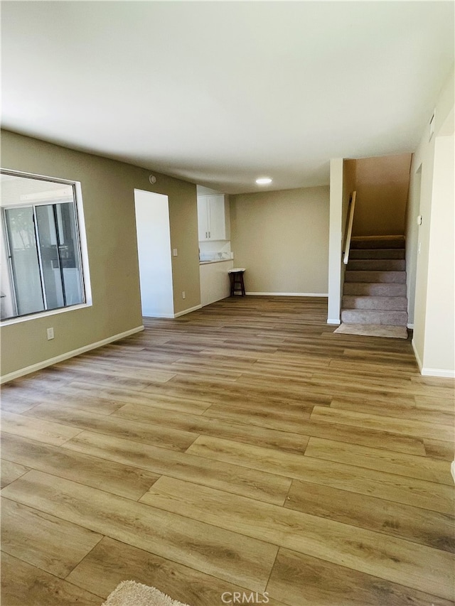 unfurnished living room featuring light hardwood / wood-style floors