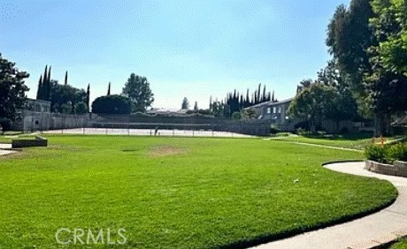 view of home's community featuring a lawn