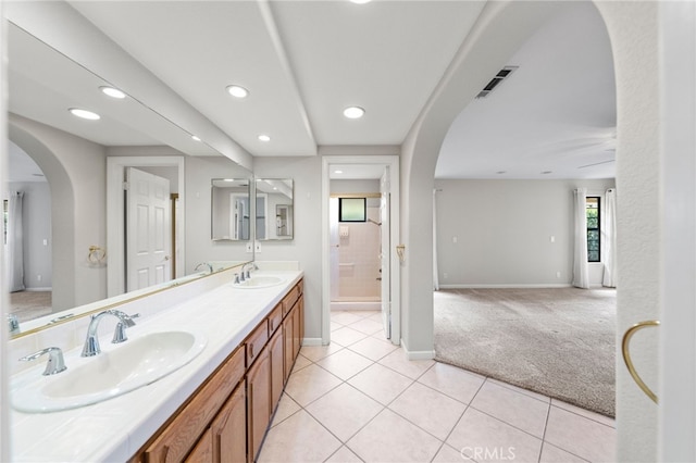 bathroom with tile patterned flooring and vanity