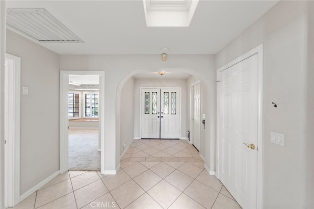 tiled entryway with french doors