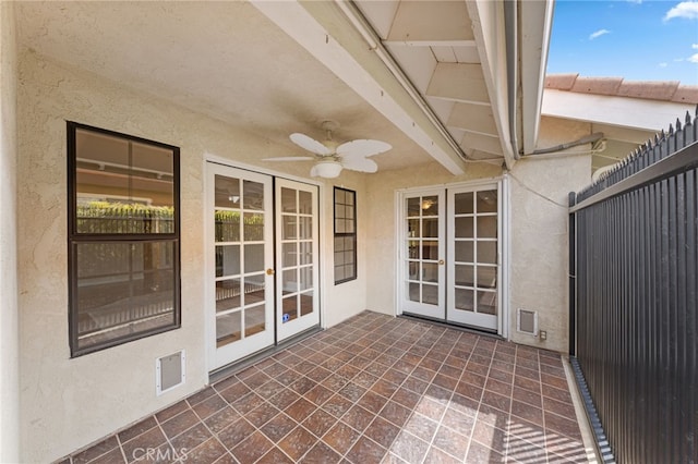 view of patio featuring ceiling fan and french doors