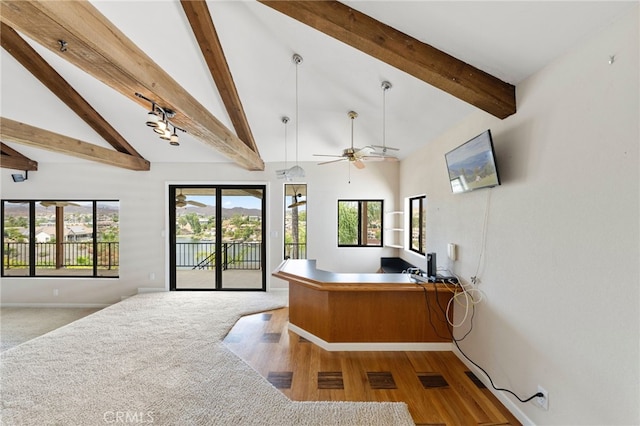 office area with beamed ceiling, wood-type flooring, a wealth of natural light, and ceiling fan