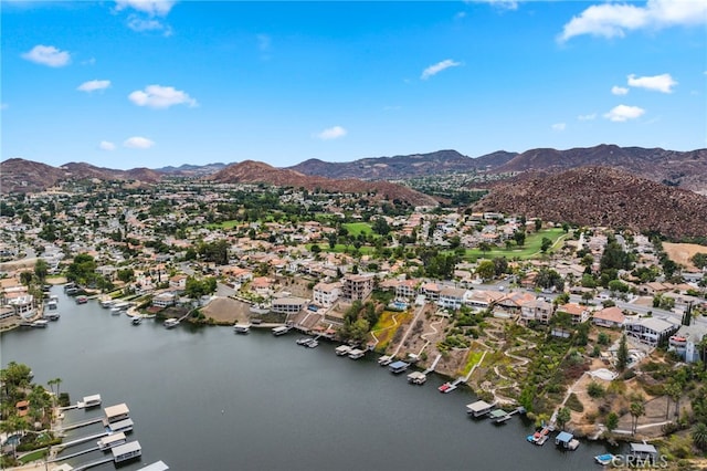 drone / aerial view with a water and mountain view