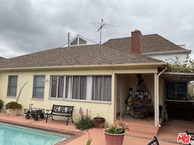 rear view of house with a patio