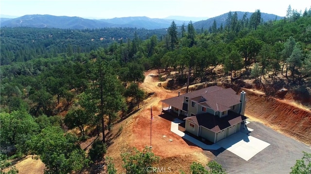 birds eye view of property with a mountain view