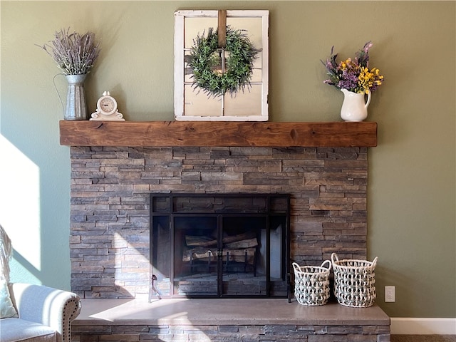 details with a stone fireplace