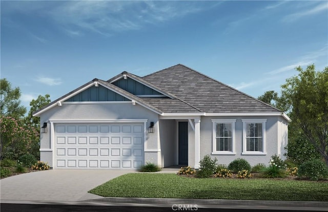 view of front facade with a garage and a front lawn