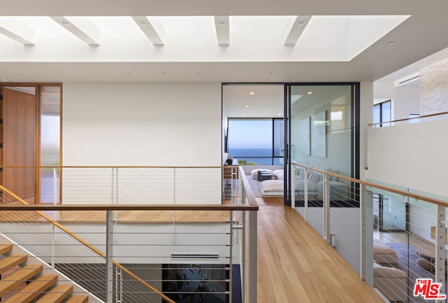 stairway featuring hardwood / wood-style flooring