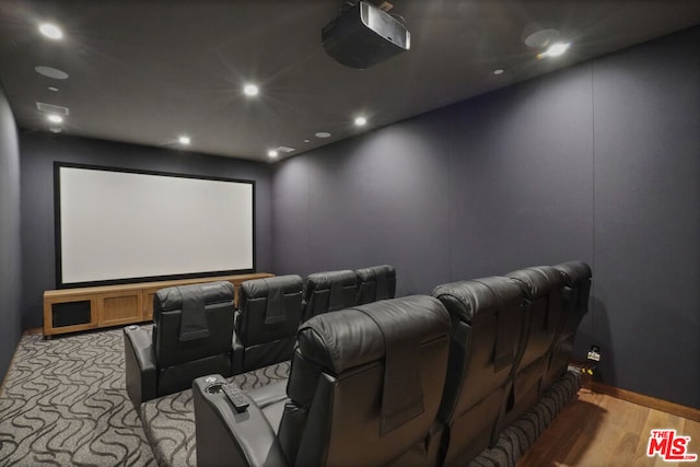 cinema room with light wood-type flooring