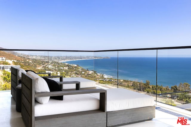 balcony featuring a water view