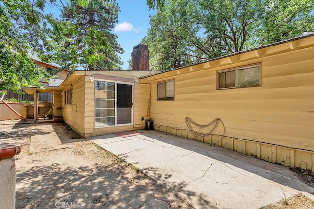 back of house with a patio